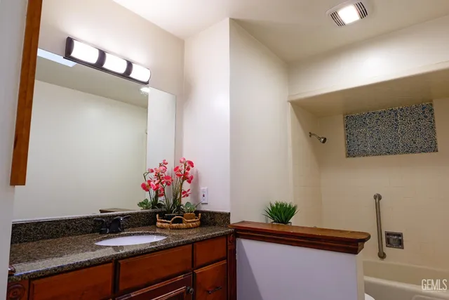 an aerial view of a house with a garden and plants