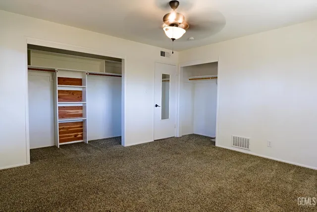 an aerial view of a house with a garden and swimming pool