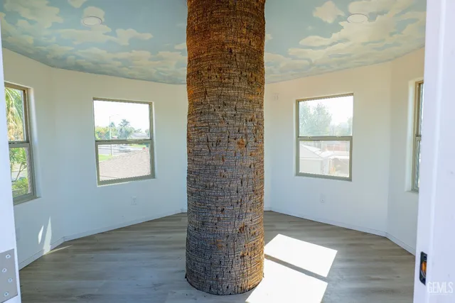 an aerial view of a house with garden space and a patio