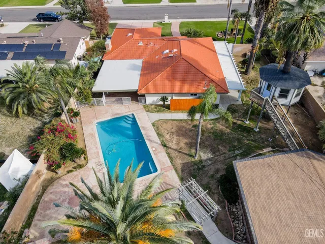 a bathroom with a sink a toilet a shower and a mirror