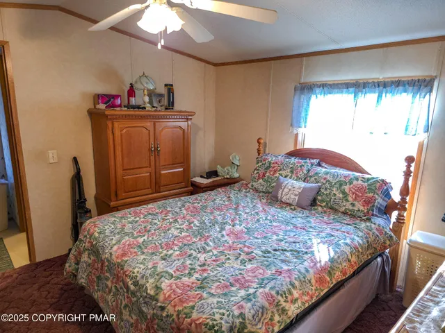 a bedroom with a bed and a mirror