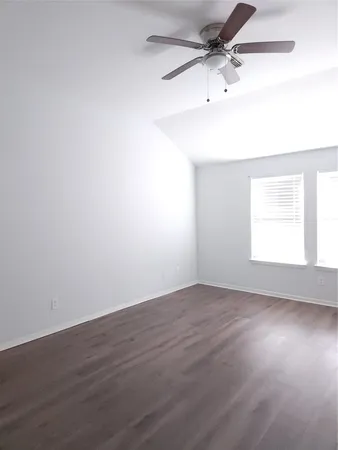 an empty room with a empty space and a window