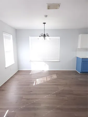 a view of a kitchen with a sink and a window