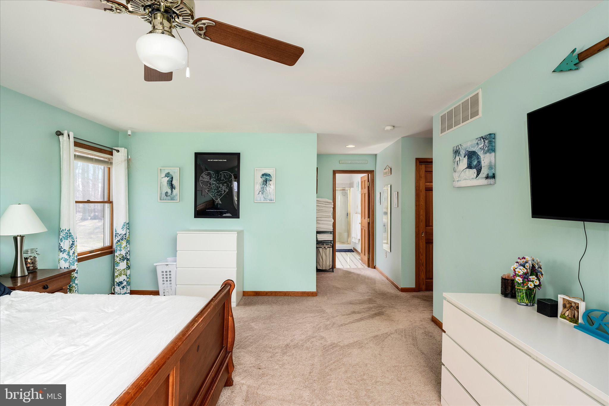 282 Chesterfield Jacobstown Road Wrightstown, NJ 08562 - Photo 23 of 70 a bedroom with a bed and a flat screen tv