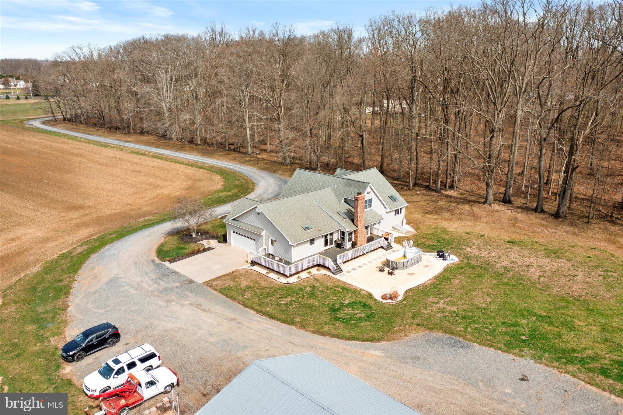 282 Chesterfield Jacobstown Road Wrightstown, NJ 08562 - Photo 3 of 70 a view of a backyard with table and chairs