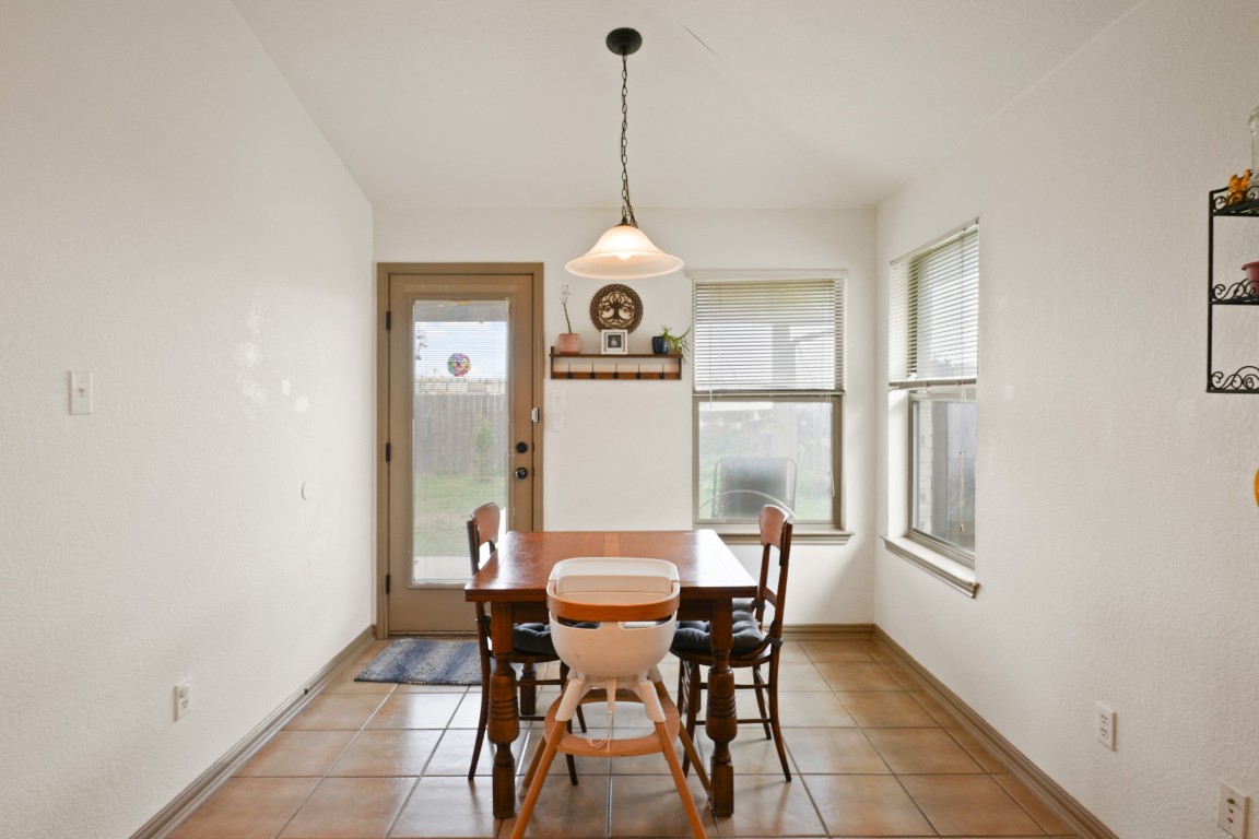 11012 Short Springs Drive Austin, TX 78754 - Photo 12 of 28 a dining room with furniture and window