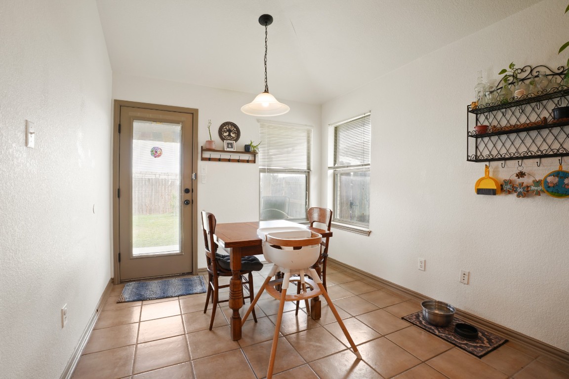 11012 Short Springs Drive Austin, TX 78754 - Photo 13 of 28 a dining room with furniture and window