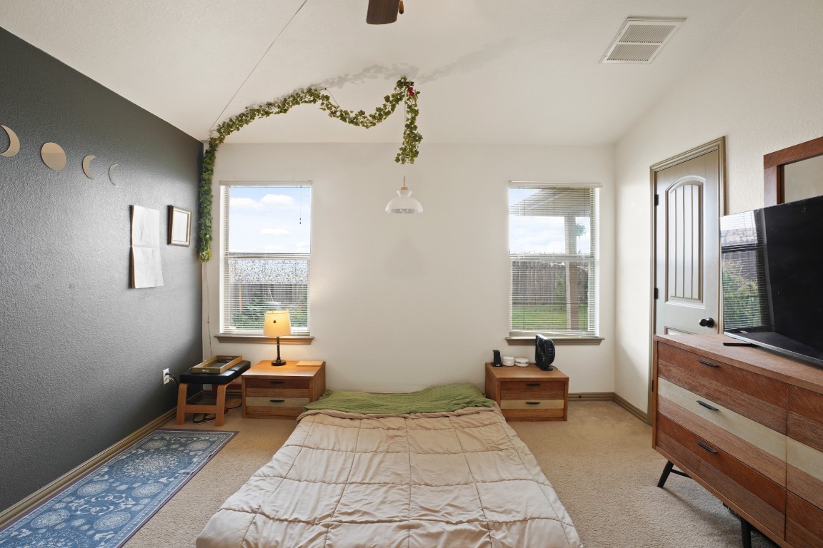 11012 Short Springs Drive Austin, TX 78754 - Photo 15 of 28 a bedroom with furniture and a window