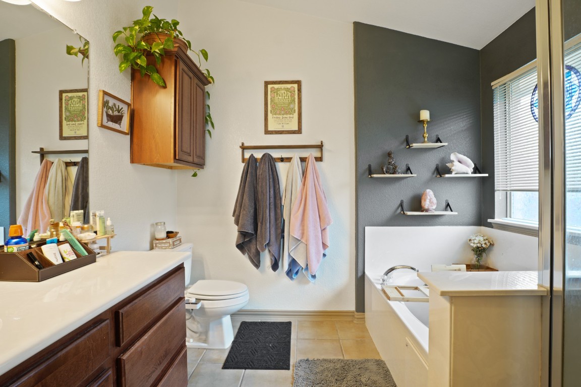 11012 Short Springs Drive Austin, TX 78754 - Photo 16 of 28 a bathroom with a sink and a mirror
