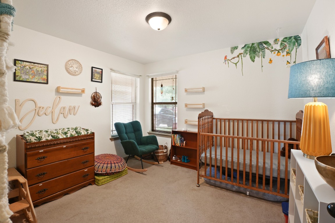 11012 Short Springs Drive Austin, TX 78754 - Photo 18 of 28 a bedroom with furniture and a window