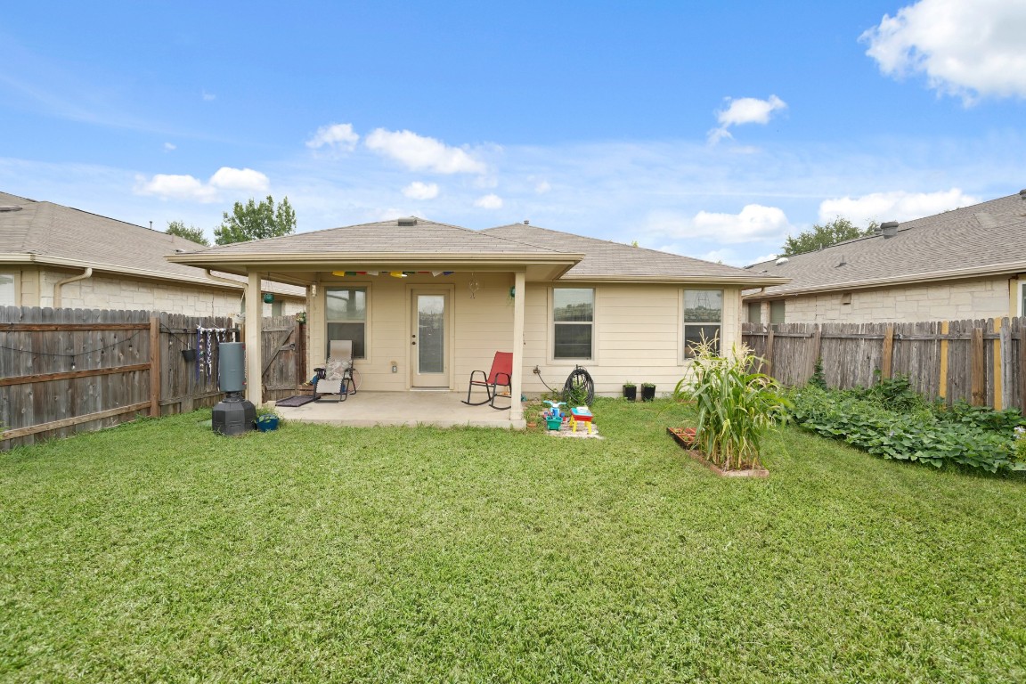 11012 Short Springs Drive Austin, TX 78754 - Photo 25 of 28 a view of a house with backyard and porch