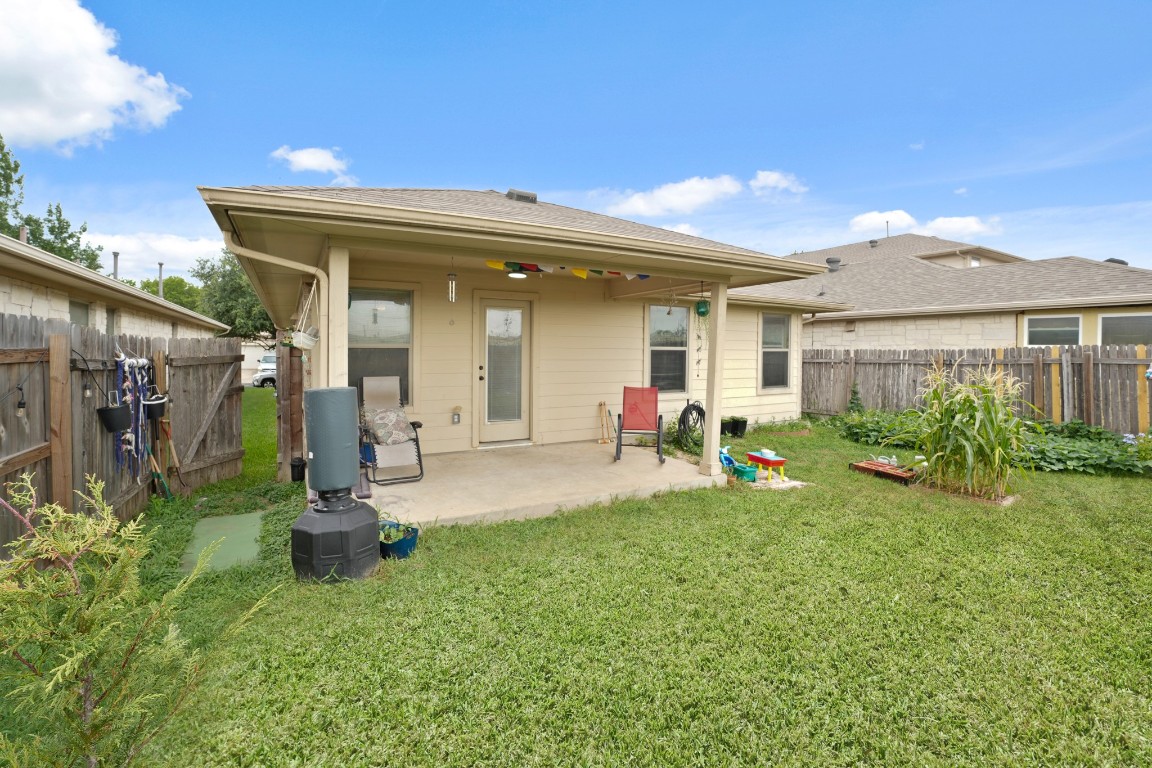 11012 Short Springs Drive Austin, TX 78754 - Photo 26 of 28 a view of a house with backyard and porch