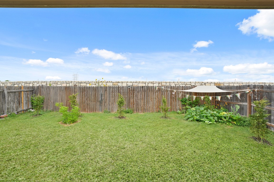 11012 Short Springs Drive Austin, TX 78754 - Photo 27 of 28 a view of a garden with houses in back