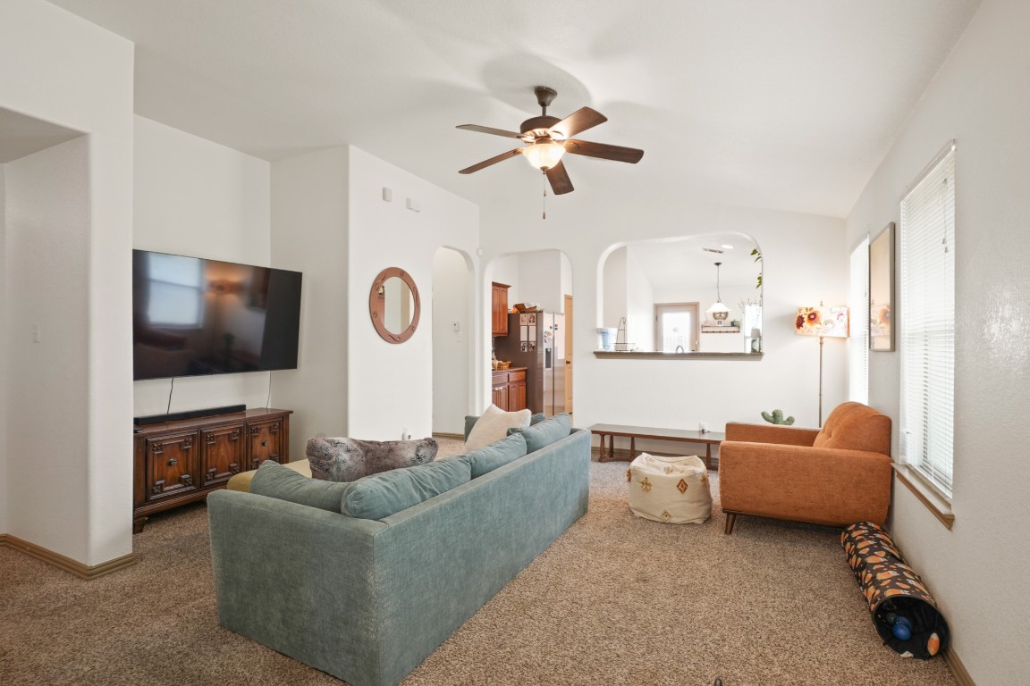 11012 Short Springs Drive Austin, TX 78754 - Photo 3 of 28 a living room with furniture and a flat screen tv