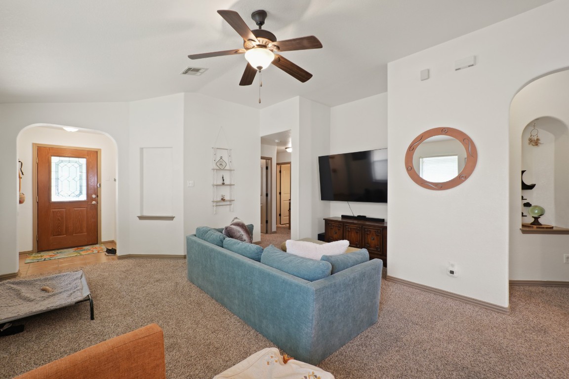 11012 Short Springs Drive Austin, TX 78754 - Photo 4 of 28 a living room with furniture and a flat screen tv