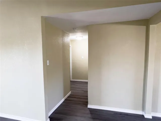 a bathroom with a toilet and a bathtub