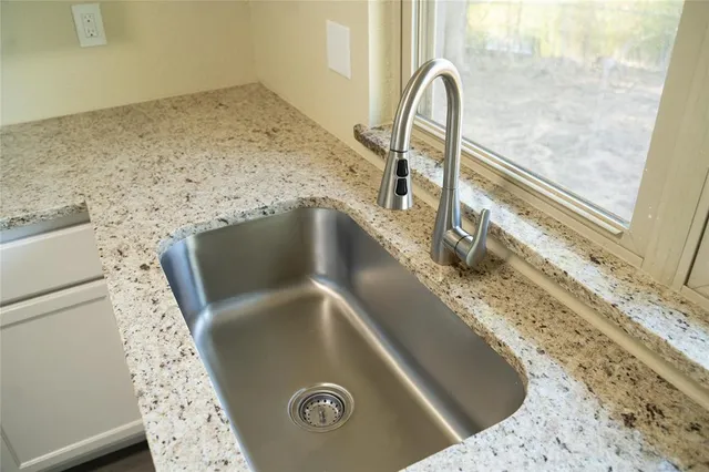 a bathroom with a toilet a sink a mirror a bathtub and shower