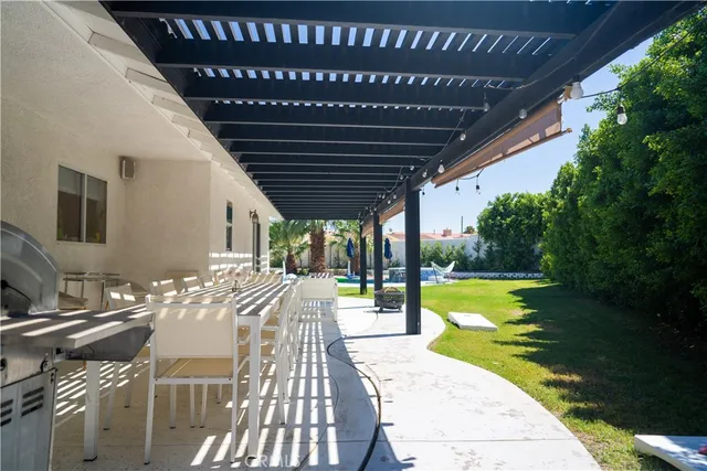 a view of a backyard with swimming pool