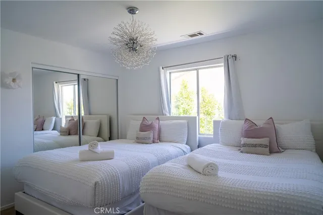 a bedroom with bed and window