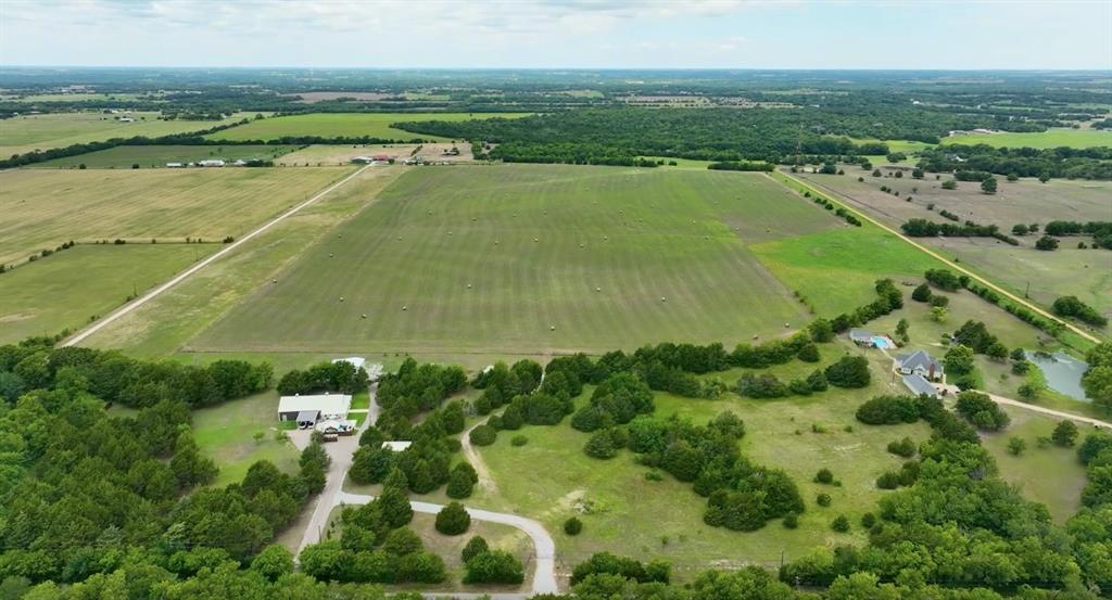 59.69-acres Bucksnort Road Van Alstyne, TX 75495 - Photo 1 of 5 a view of a lake with a city