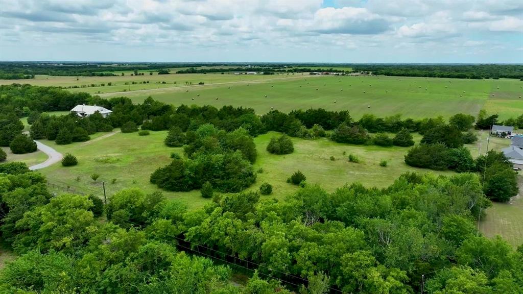 59.69-acres Bucksnort Road Van Alstyne, TX 75495 - Photo 3 of 5 a view of a lake with a city