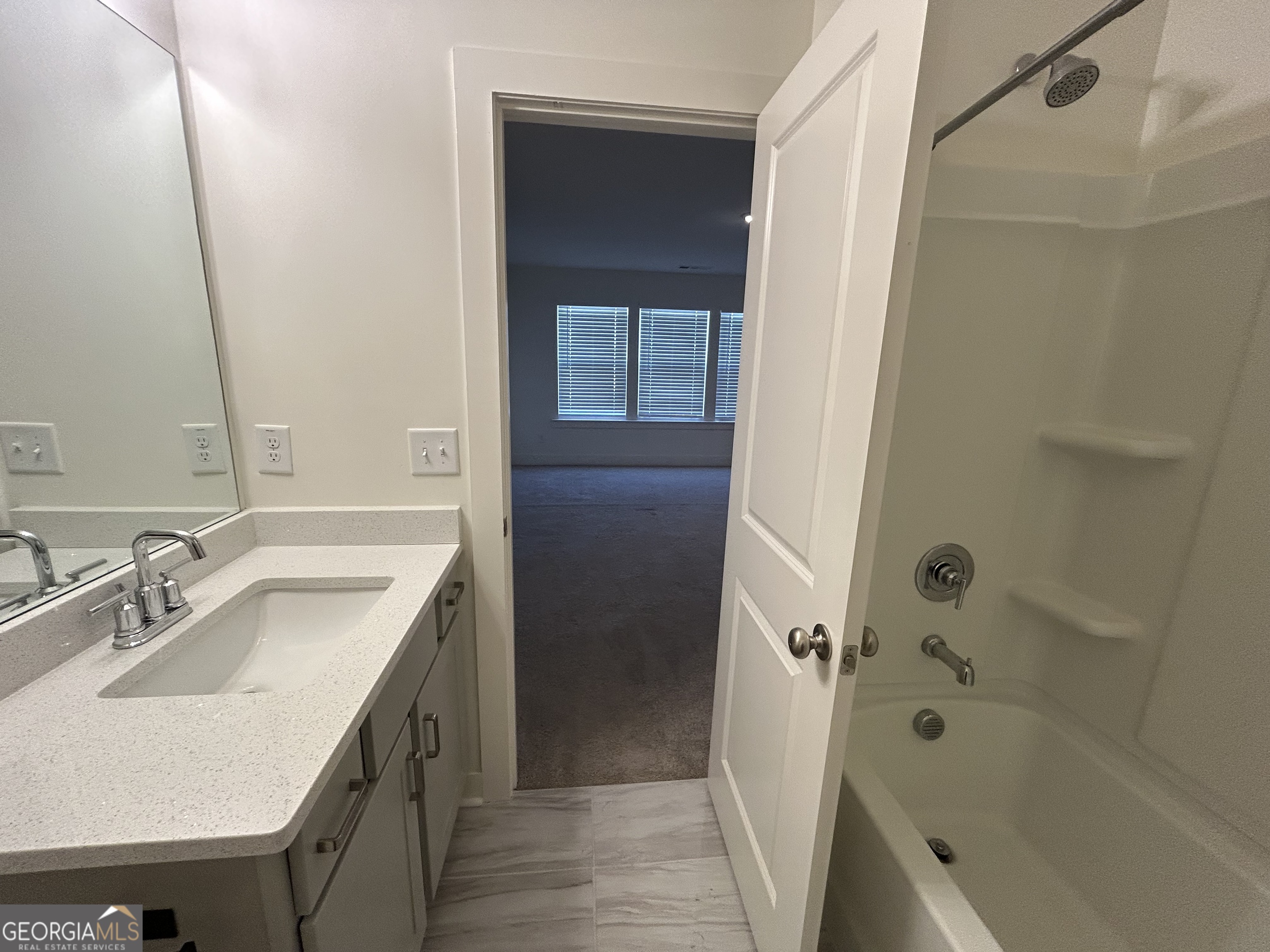 7741 Squire Court Fairburn, GA 30213 - Photo 17 of 25 a bathroom with a sink a toilet and shower