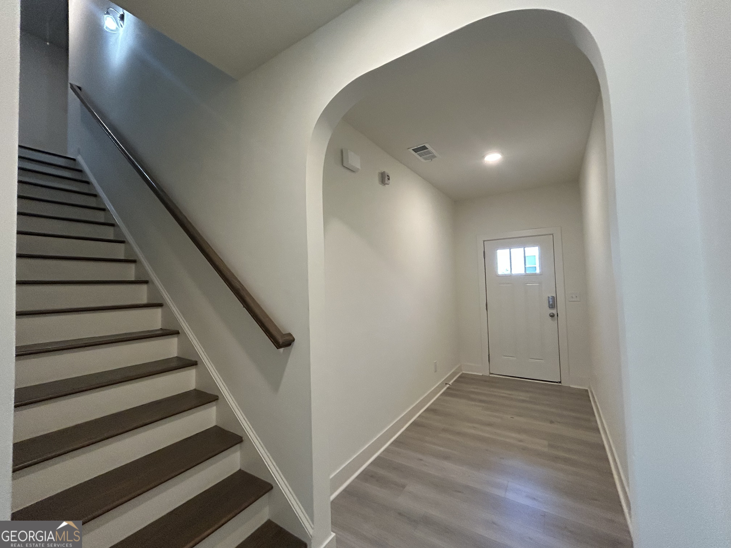 7741 Squire Court Fairburn, GA 30213 - Photo 3 of 25 a view of entryway with wooden floor