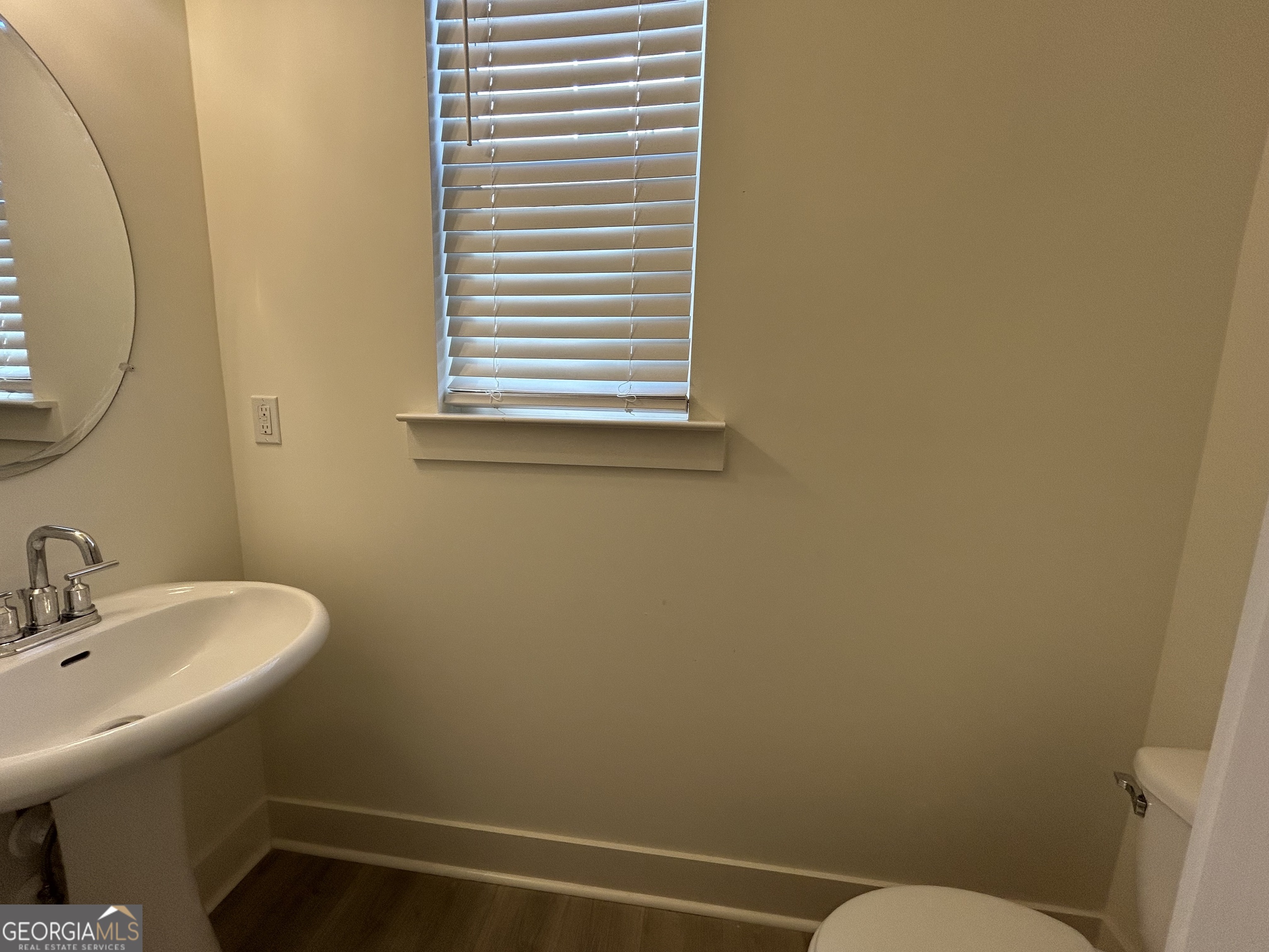 7741 Squire Court Fairburn, GA 30213 - Photo 8 of 25 a bathroom with a sink and a toilet
