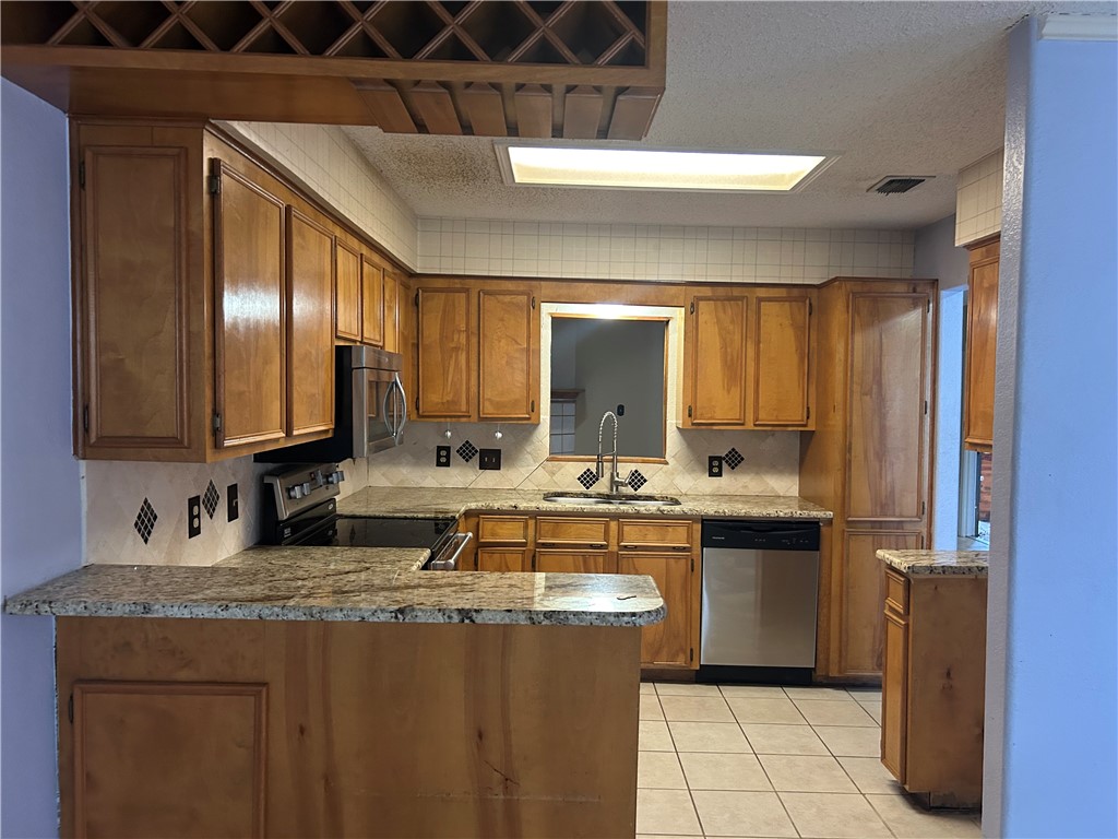 4530 Windows Drive Corpus Christi, TX 78413 - Photo 3 of 11 a kitchen with a sink and cabinets