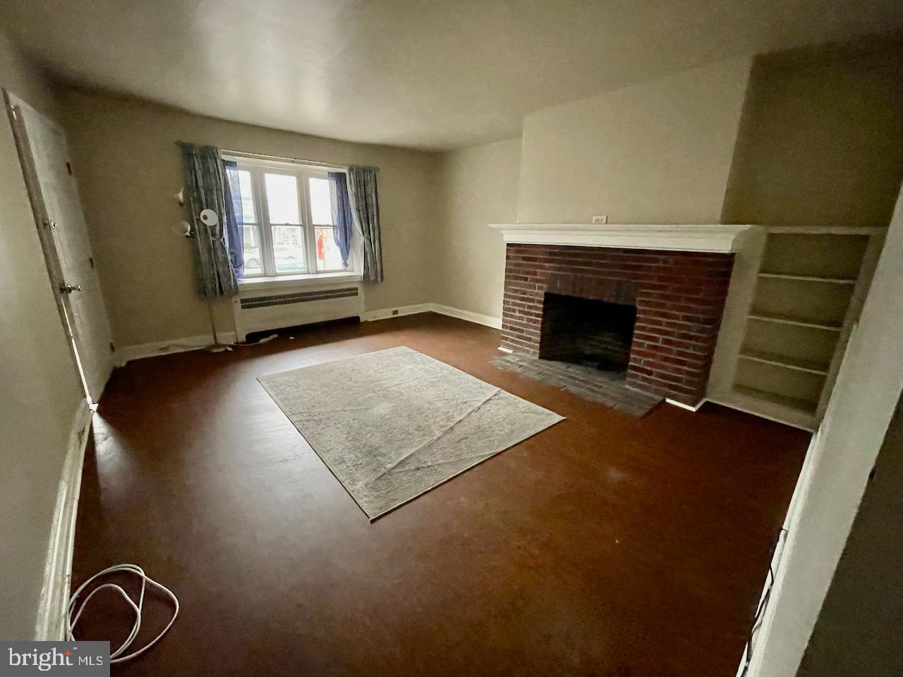 917 Darby Road Havertown, PA 19083 - Photo 5 of 16 Spacious room with charming fireplace.