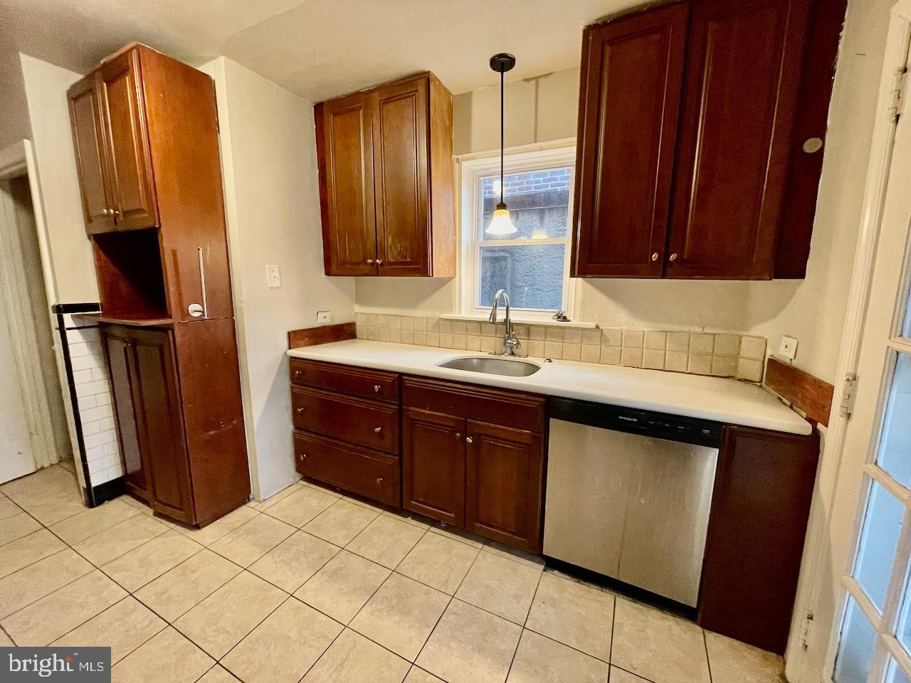 917 Darby Road Havertown, PA 19083 - Photo 7 of 16 Cozy kitchen with rich wooden cabinetry.