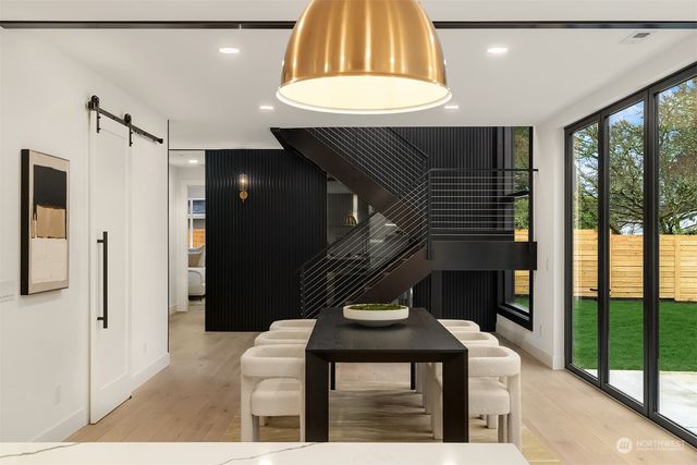 a kitchen with a table and chairs