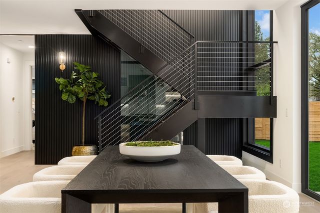 a kitchen with kitchen island a sink stove and refrigerator