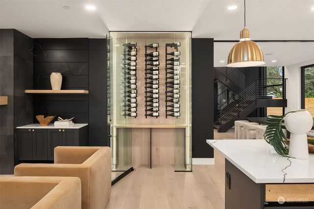 a kitchen with a table chairs sink and cabinets