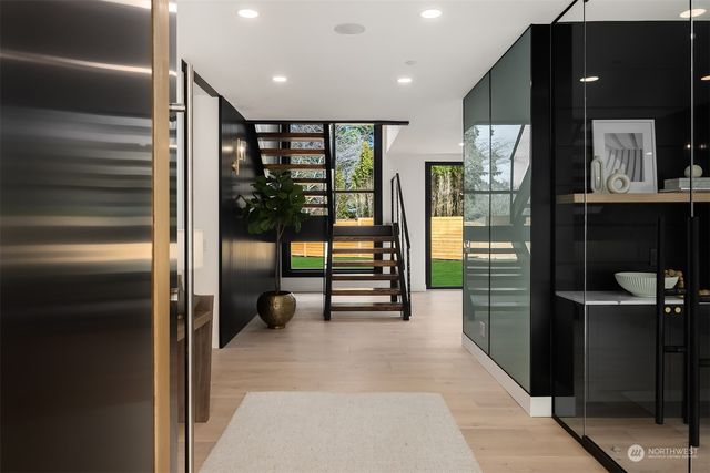 a living room with fireplace furniture and a large window
