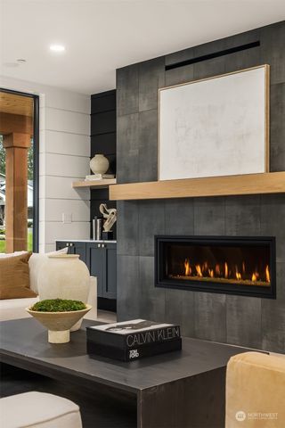 a living room with a table a table and chairs