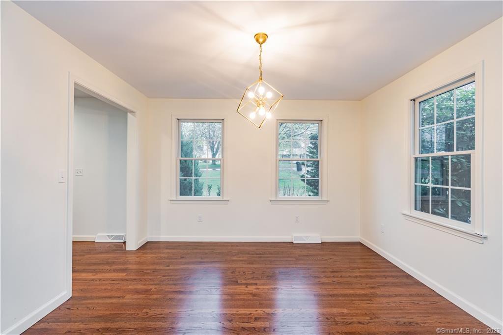 1241 Halladay Avenue West Suffield, CT 06078 - Photo 10 of 29 a view of empty room with wooden floor and fan