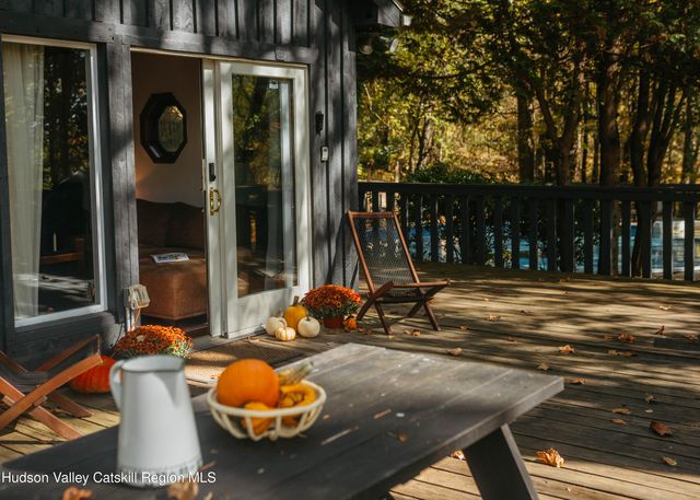 a view of a house with backyard outdoor space and sitting area