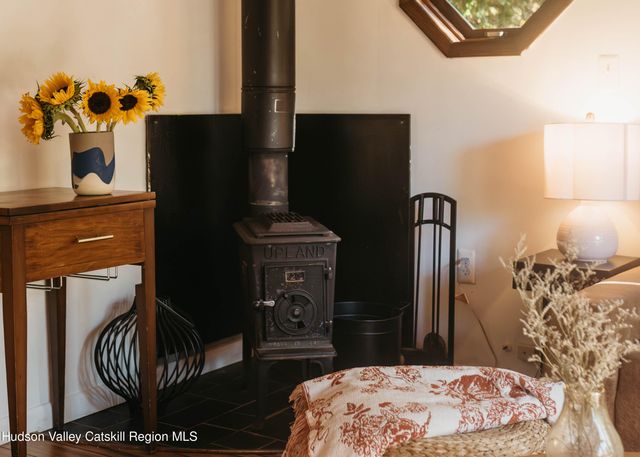 a bedroom with a bed and a television