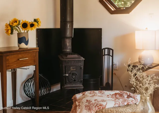 a bedroom with a bed and a television