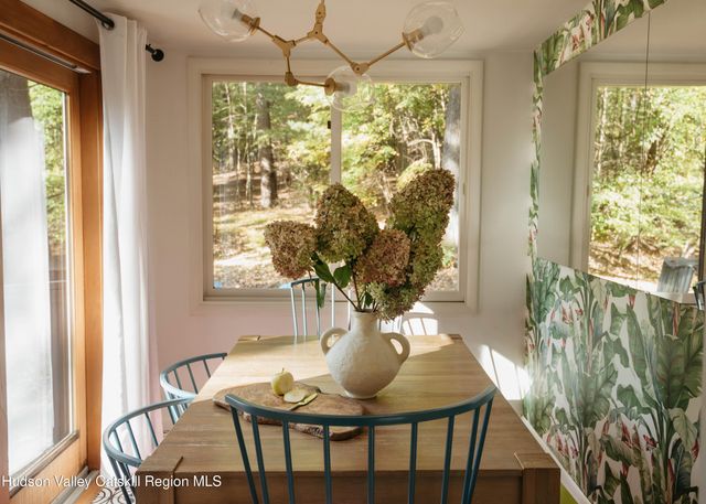 a view of a dining room with furniture window and outside view
