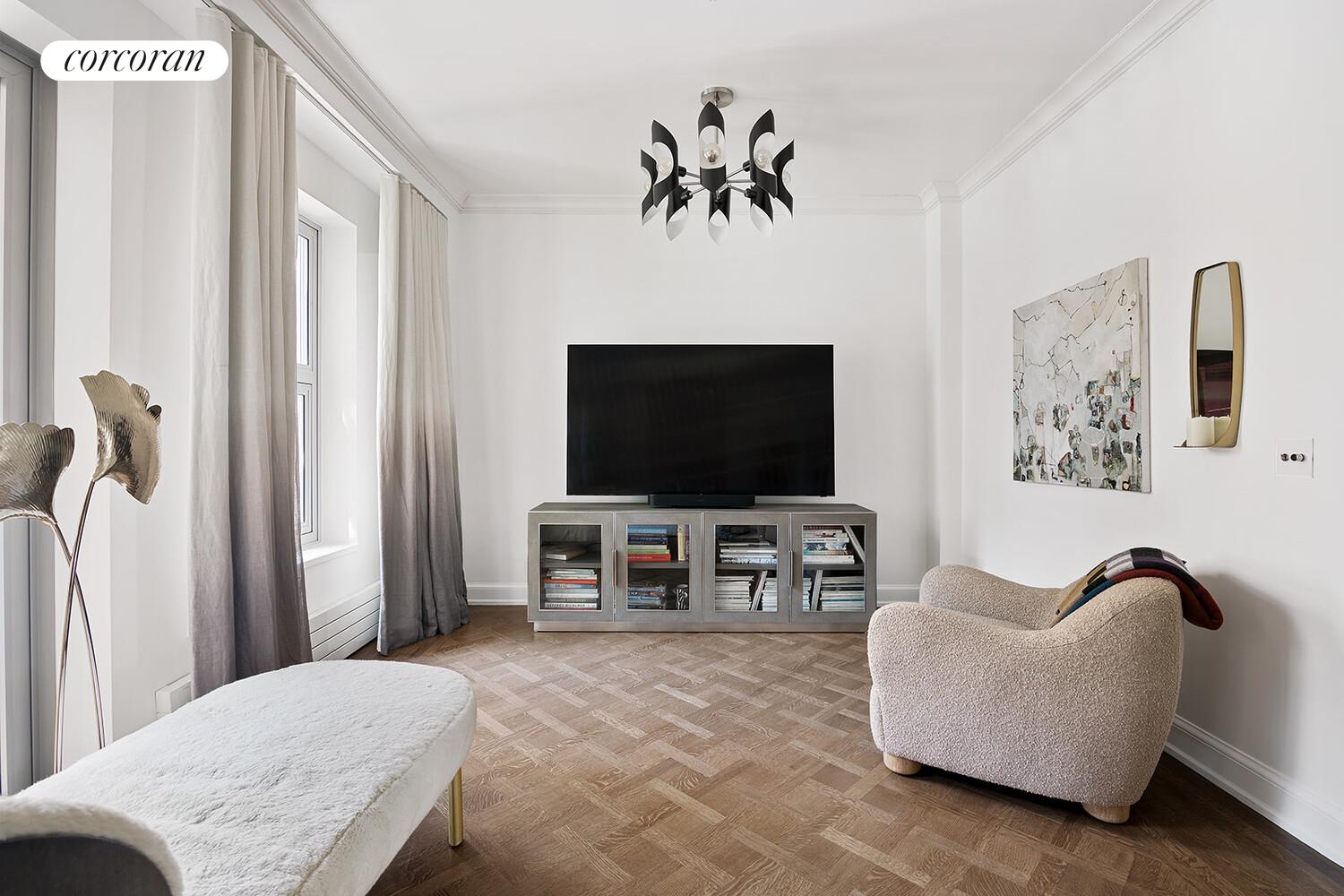 16 West 21st Street, Unit 10/11 Manhattan, NY 10010 - Photo 10 of 18 a living room with furniture and a flat screen tv