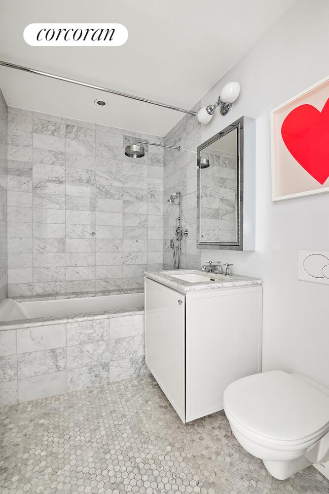 16 West 21st Street, Unit 10/11 Manhattan, NY 10010 - Photo 13 of 18 a bathroom with a sink a toilet and shower