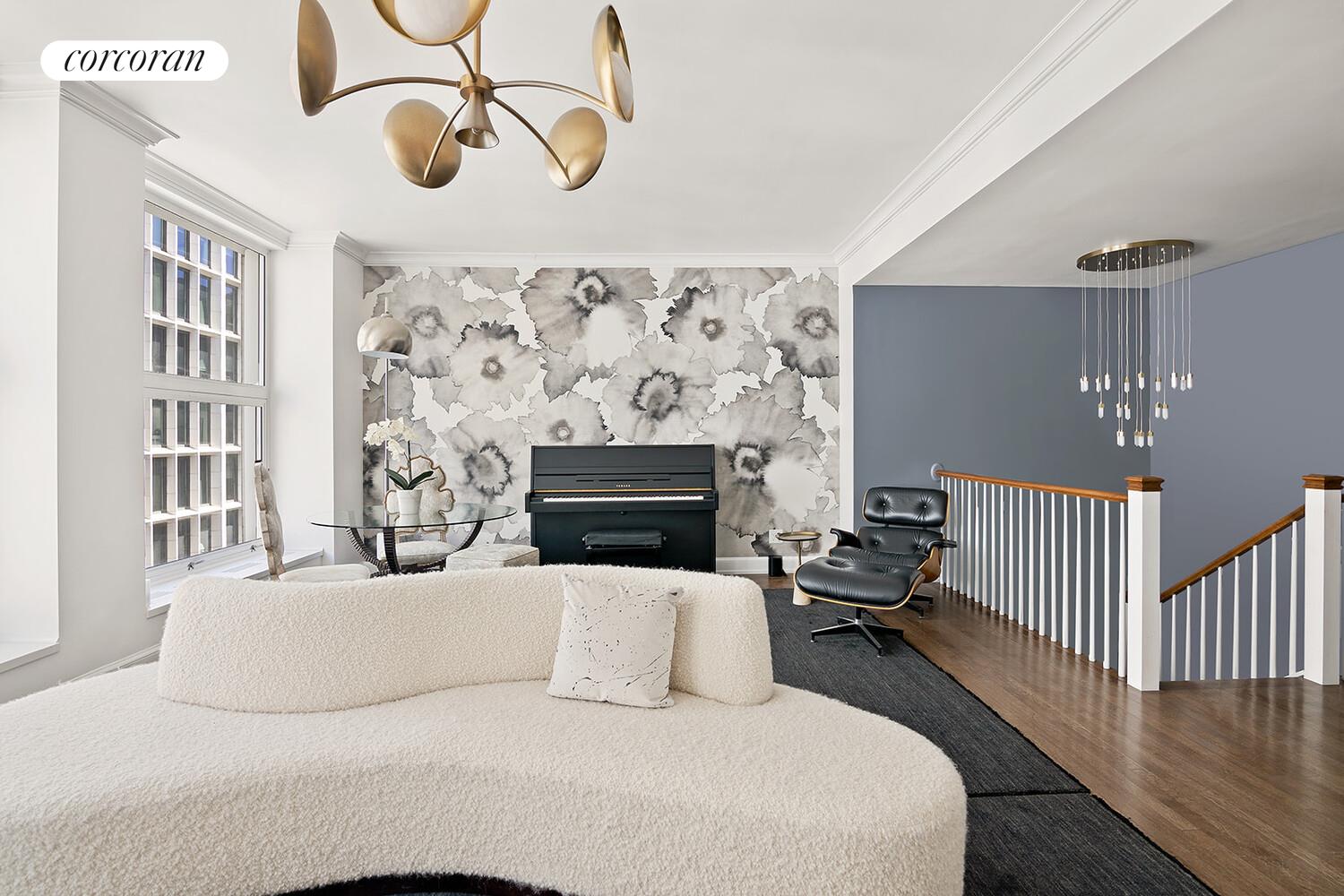 16 West 21st Street, Unit 10/11 Manhattan, NY 10010 - Photo 3 of 18 a living room with furniture and a fireplace