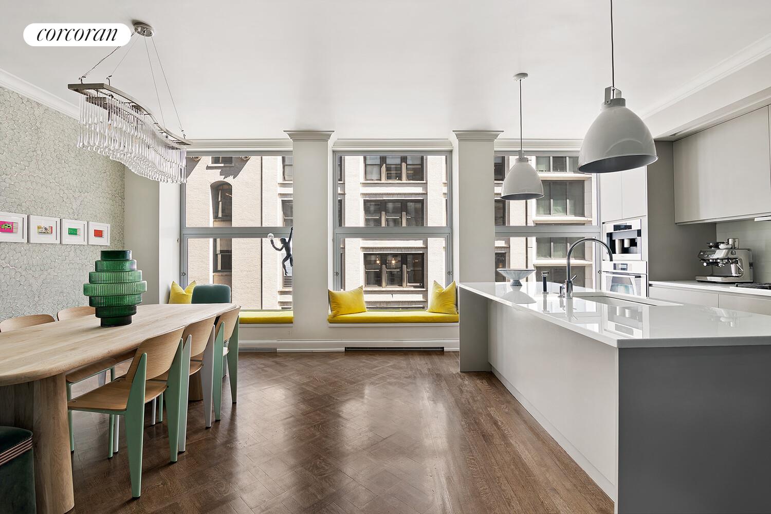 16 West 21st Street, Unit 10/11 Manhattan, NY 10010 - Photo 4 of 18 a kitchen with stainless steel appliances granite countertop a sink a stove and a wooden floors