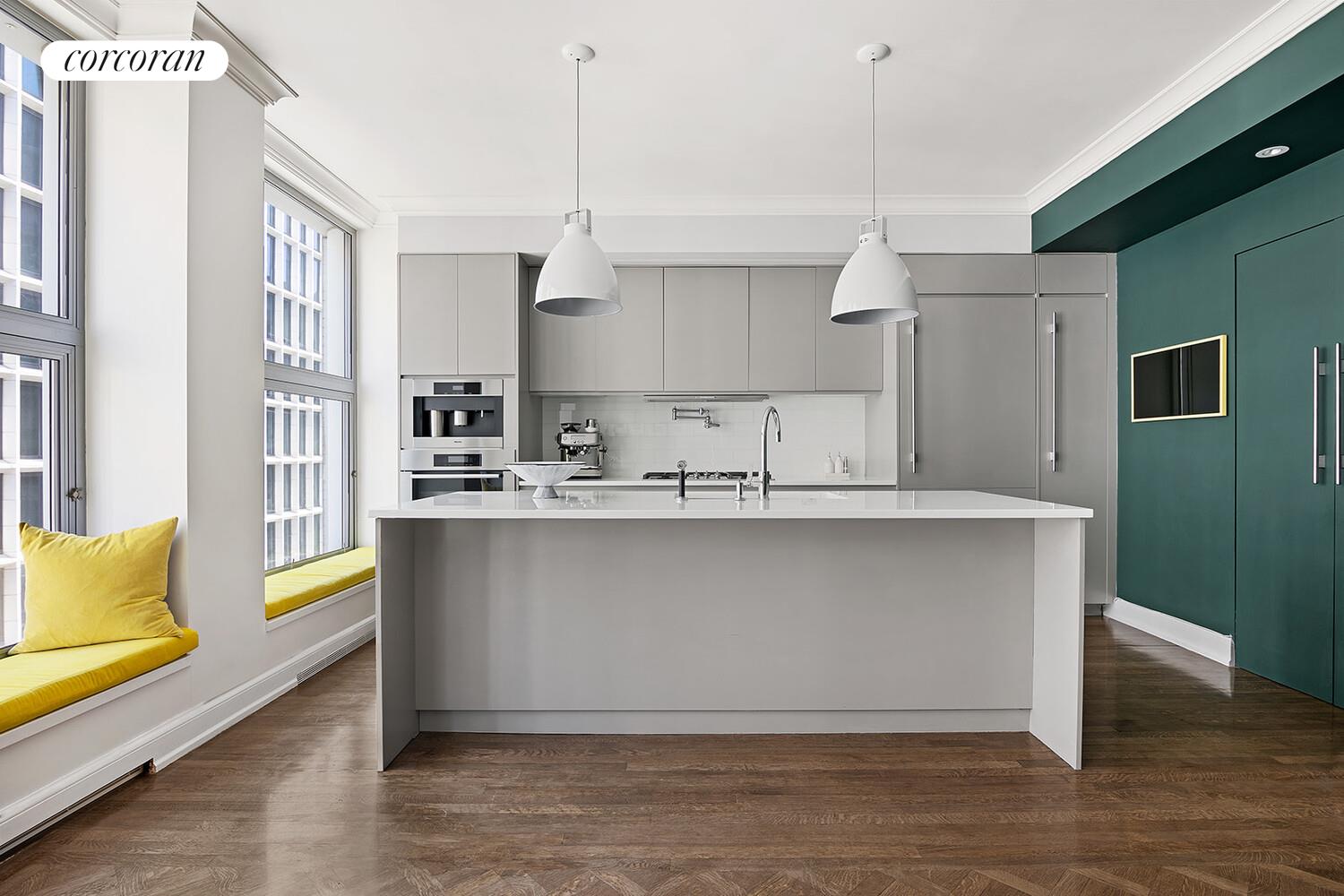 16 West 21st Street, Unit 10/11 Manhattan, NY 10010 - Photo 5 of 18 a kitchen with stainless steel appliances granite countertop a refrigerator a sink and a stove