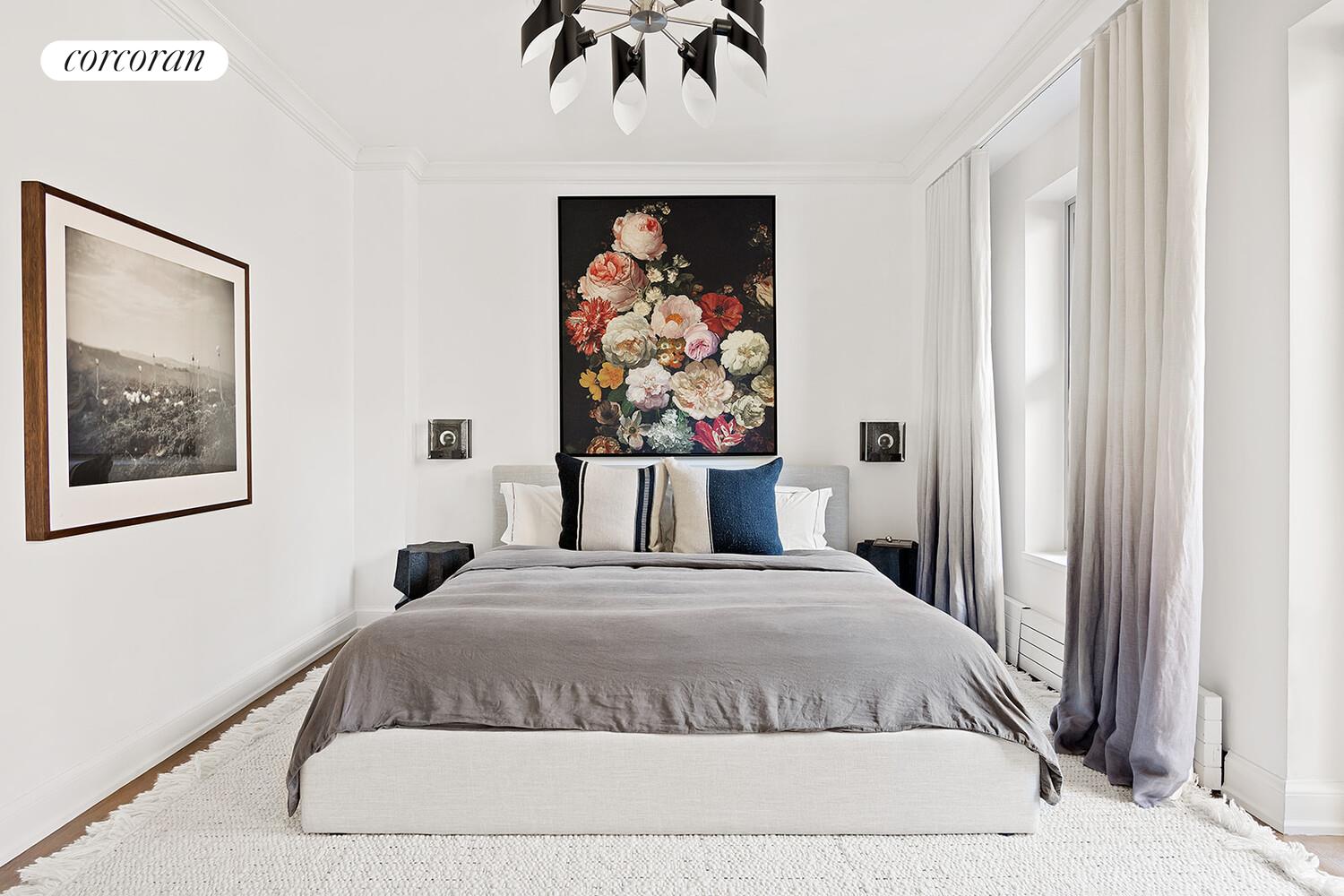 16 West 21st Street, Unit 10/11 Manhattan, NY 10010 - Photo 7 of 18 a bedroom with a bed and a painting on the wall