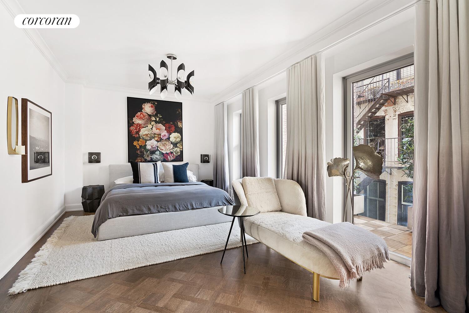 16 West 21st Street, Unit 10/11 Manhattan, NY 10010 - Photo 8 of 18 a bedroom with a bed mirror and window