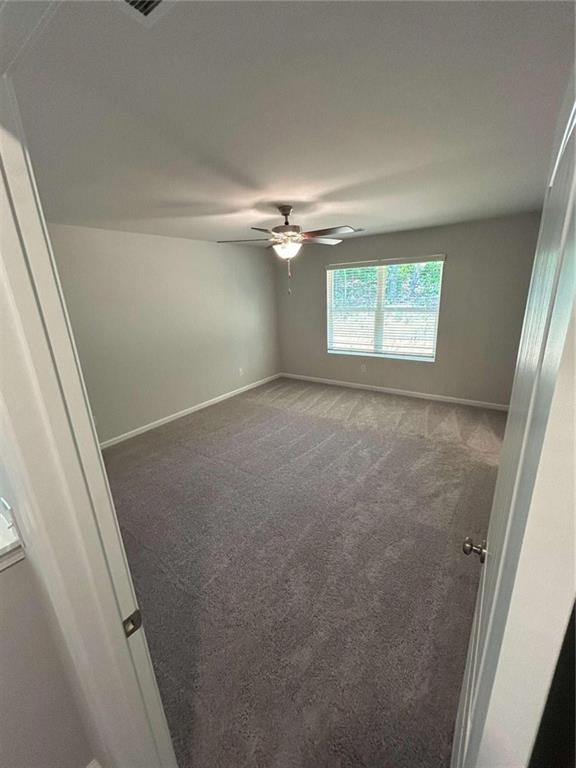 4 Stonebrook Drive Rome, GA 30165 - Photo 12 of 19 an empty room with a ceiling fan and a window