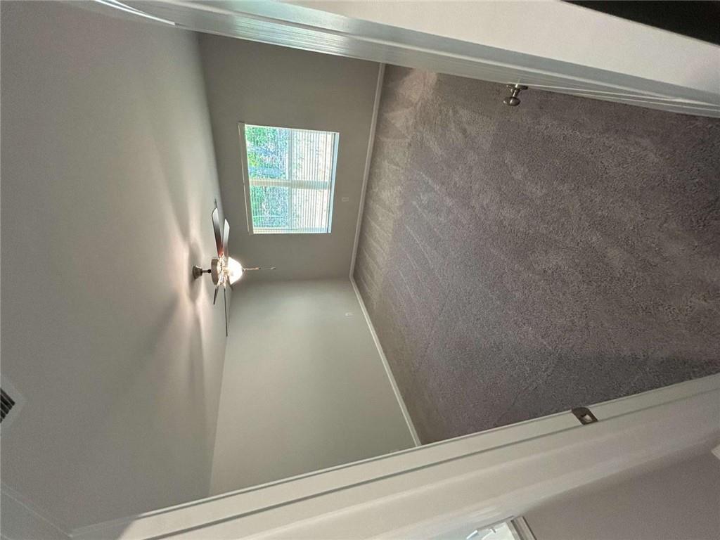 4 Stonebrook Drive Rome, GA 30165 - Photo 12 of 19 an empty room with a ceiling fan and a window